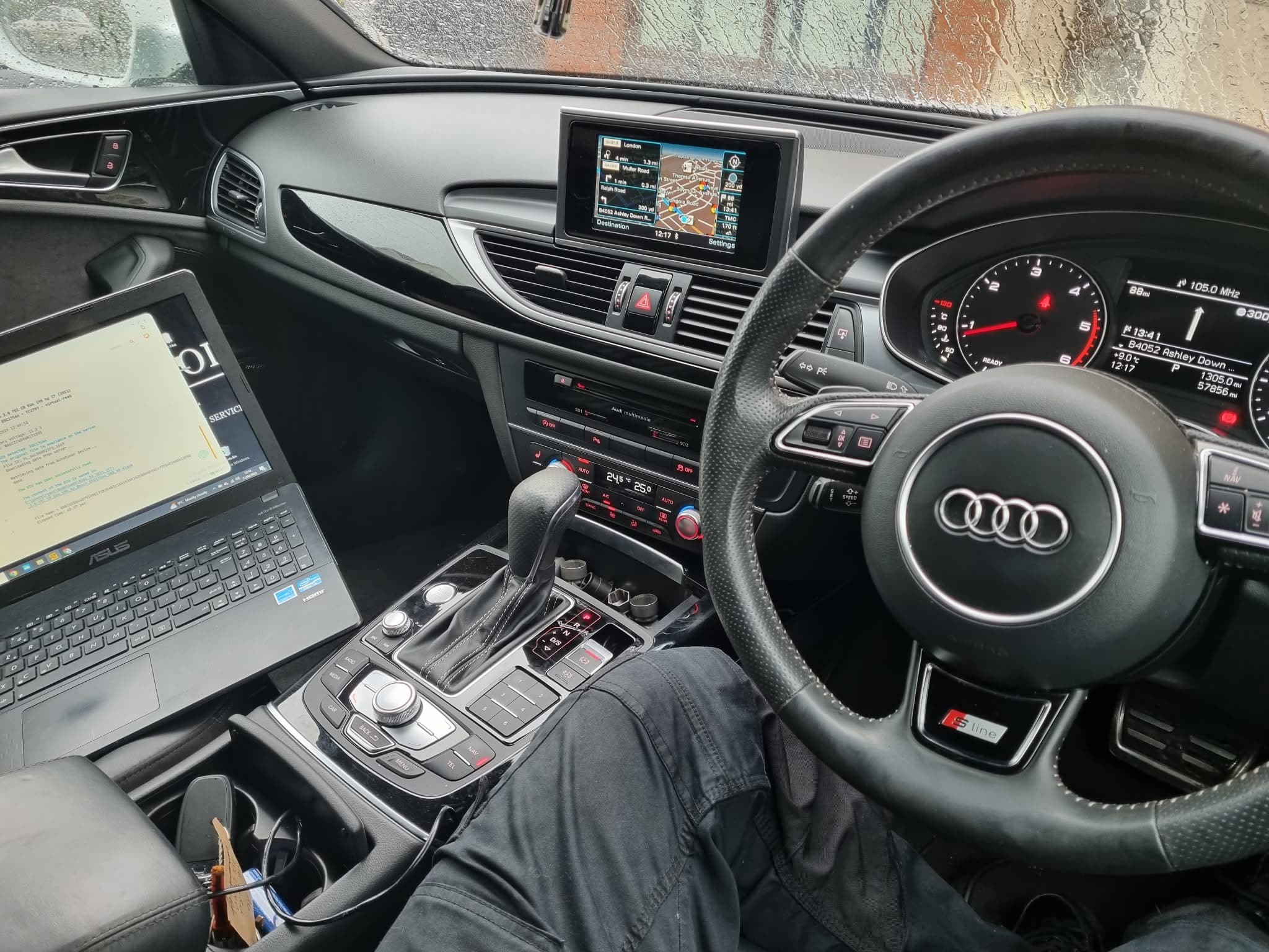 Professional ECU remapping service representative checking engine components